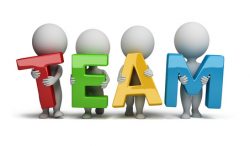 3d small people holding hands in the word "team". 3d image. Isolated white background.